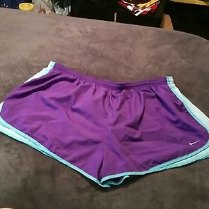 Purple and blue nike tempos